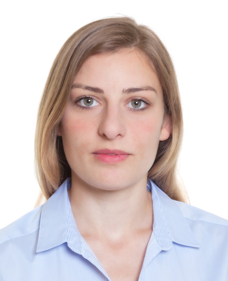 Example of an identity photo of a young fair woman with blue eyes wearing a blue shirt